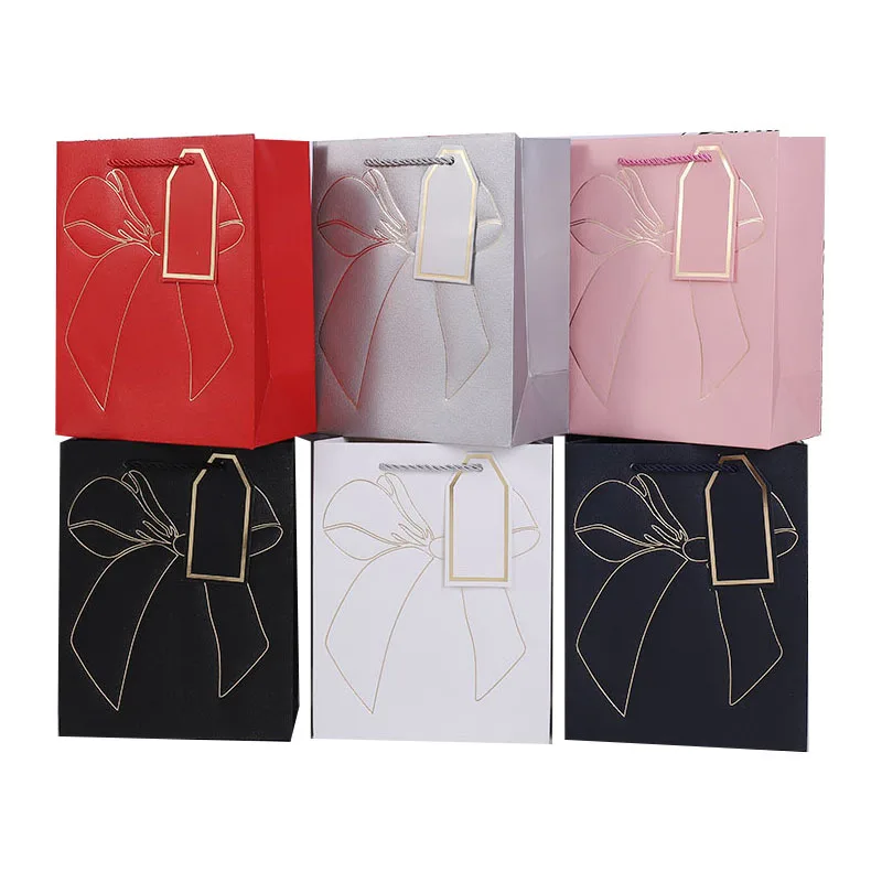 Custom luxury white cardboard waterproof and oil proof style competitive price kraft paper bags christmas small paper bags
