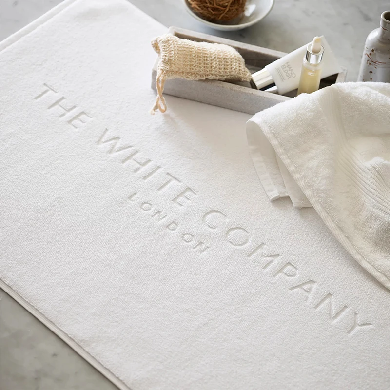 Оптовая продажа, пользовательский Жаккардовый Логотип, нескользящий белый Хлопковый махровый коврик для ванной для отеля, спа, ванной