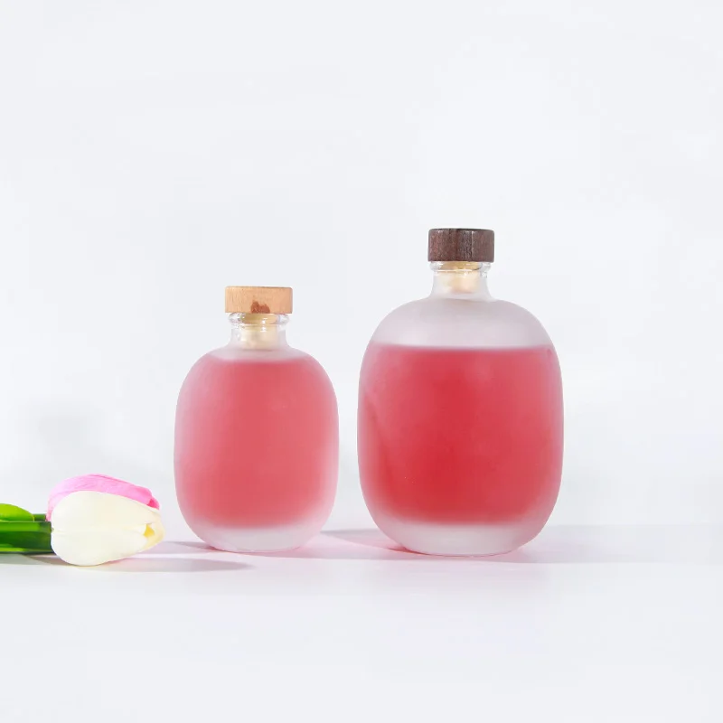 High Quality Empty 100 ml 250 ml 500 ml Round Frosted Transparent Glass Bottles for for Beverage Juice Coffee with Corks