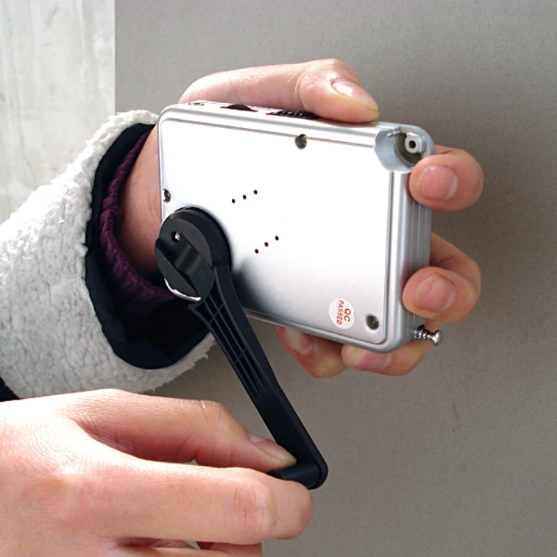 
self-powered LED light radio with phone charger Hand shake mini pocket size crank dynamo light radio flashlight torch 
