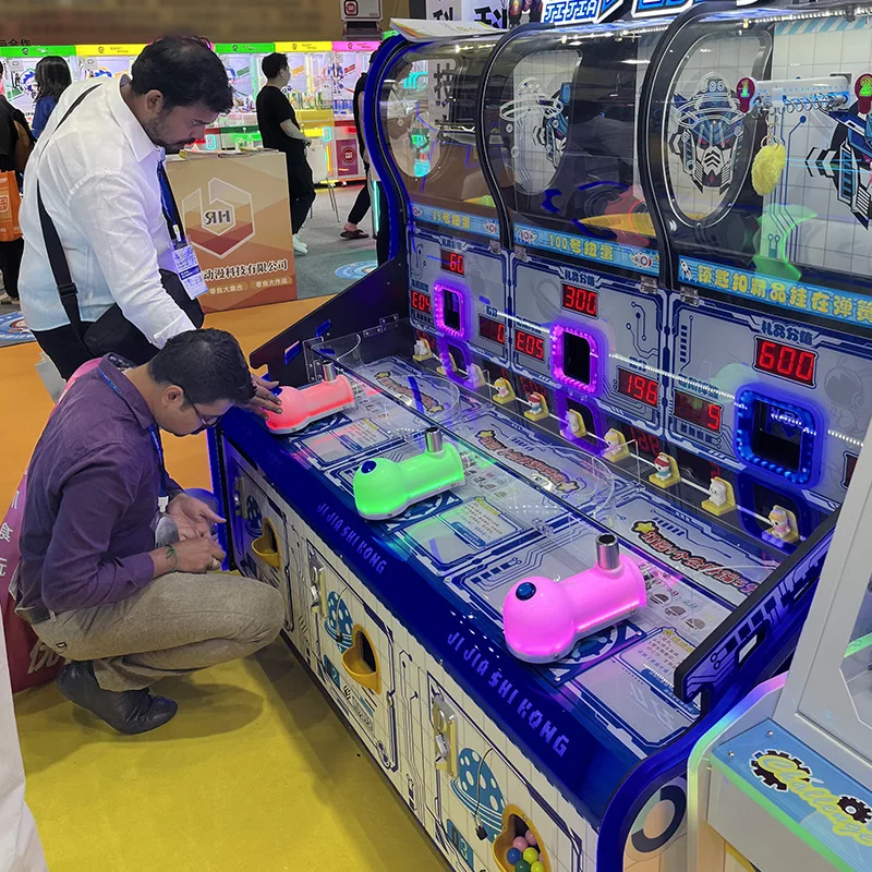 Best selling coin operated kids shooting ball machine mecha space-time 3 people shooting twist egg key chain gift machine