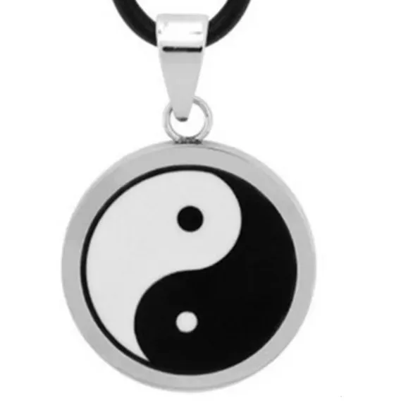 A yin-yang ancient symbol the black and white ceramic is inlaid in stainless steel frame
