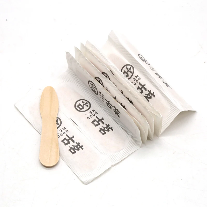 paper wrapped magnum popsicle wood ice cream spoon