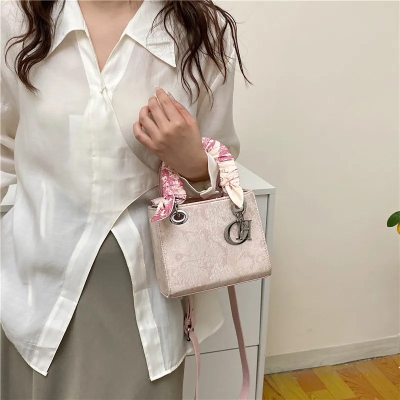 High quality designer floral texture ribbon handbag fashionable daily outfit women shoulder crossbody bag elegant charming