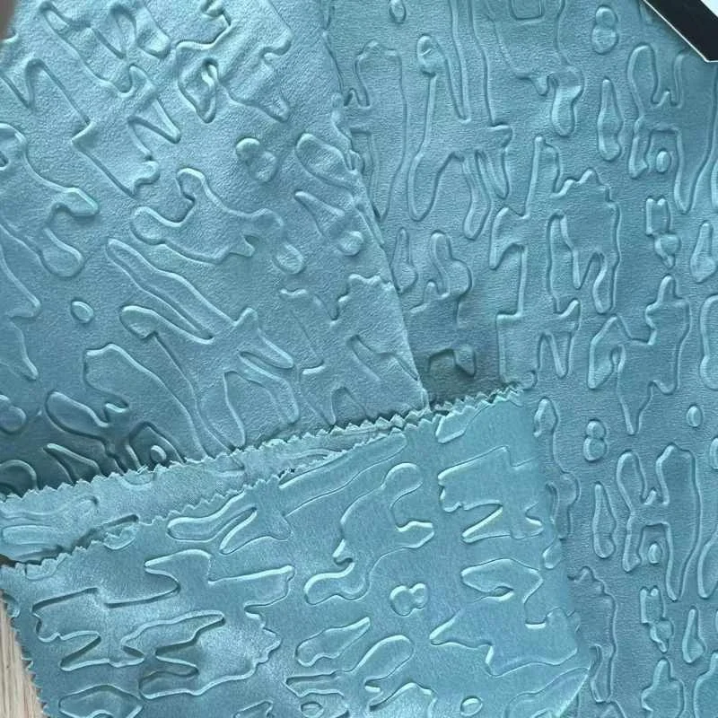 New arrival 75D spandex 100%polyester silk embossed fabric for women dress clothes