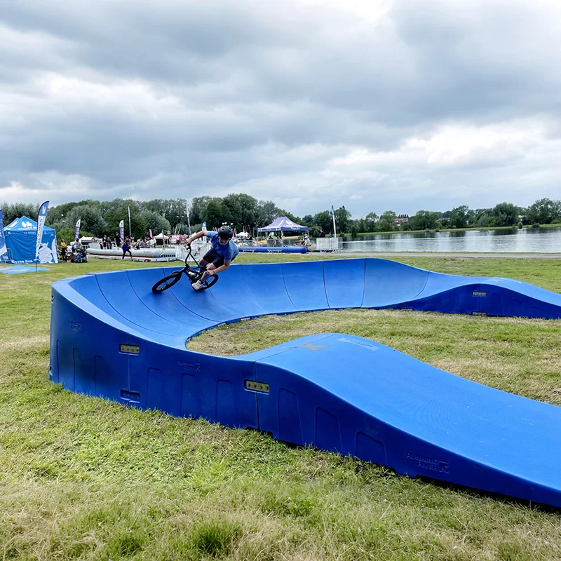 Plastic modular pump track velocity loop 2 is a sequence of roll overs  and berms  for bikes, BMX scooters and skateboards