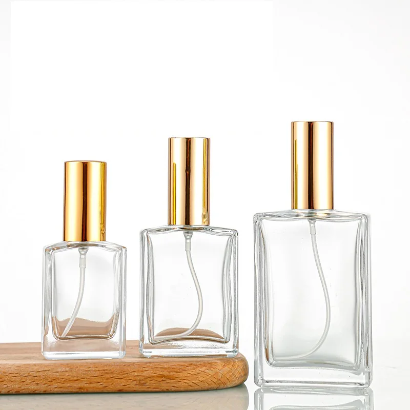 Luxury 30ml 50ml 100ml Clear Glass Perfume Atomizer Bottle Flat Shoulder Square Design with Fine Mist for Cosmetics