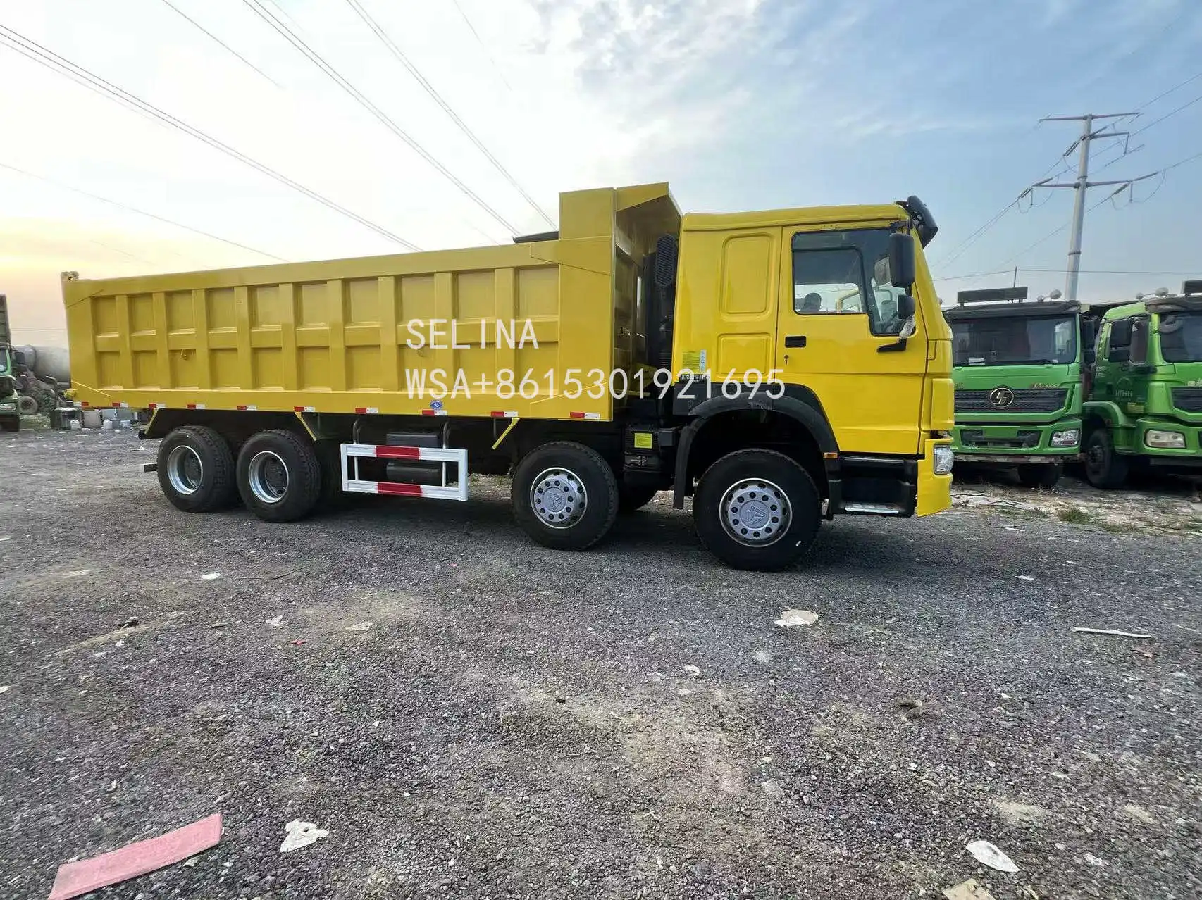 USED HOWO 8X4 DUMP TRUCK WITH EURO 4 EMISSION HYDRAULIC DUMP SYSTEM 380 HP