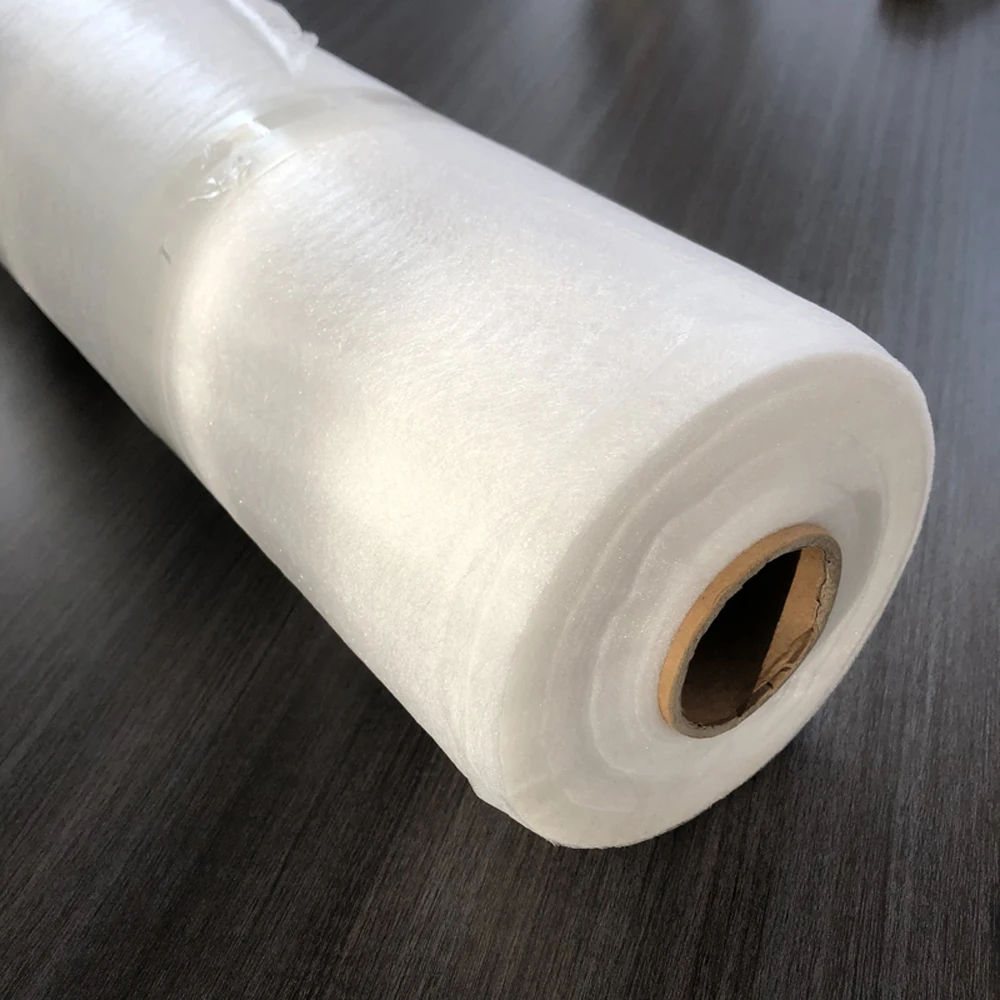 Hot melt adhesive web used for bonding fabrics together