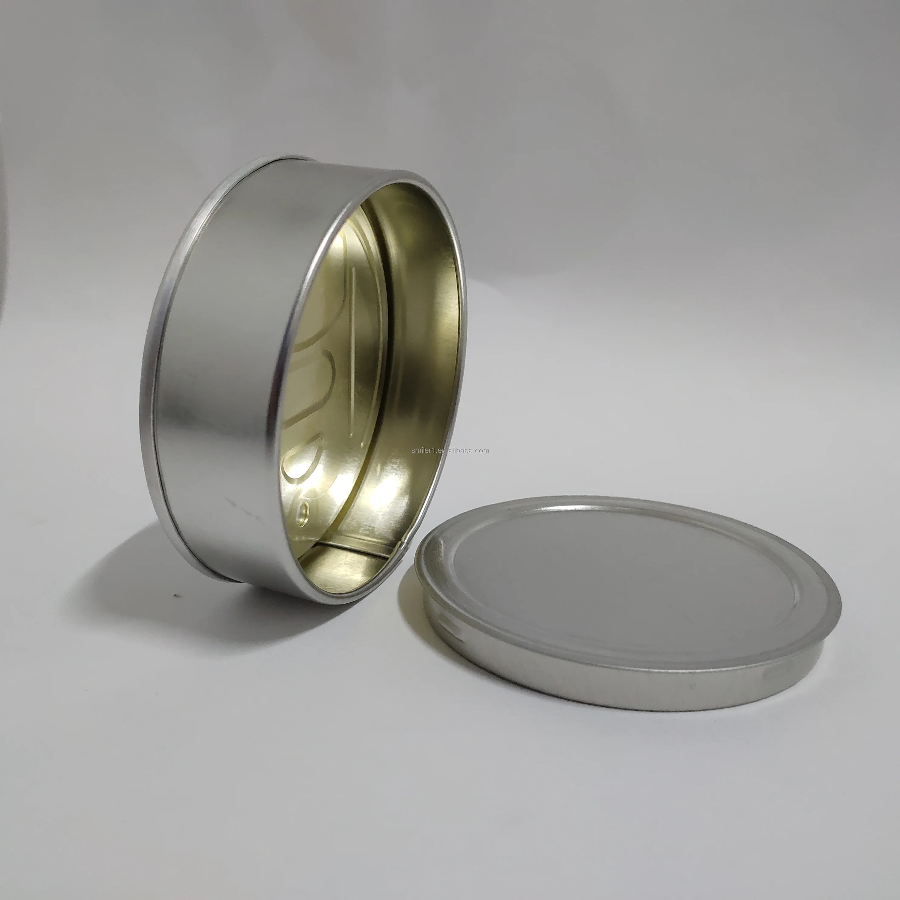 
3.5gram pressitin tin wholesale with clear or black plastic top and custom stickers 