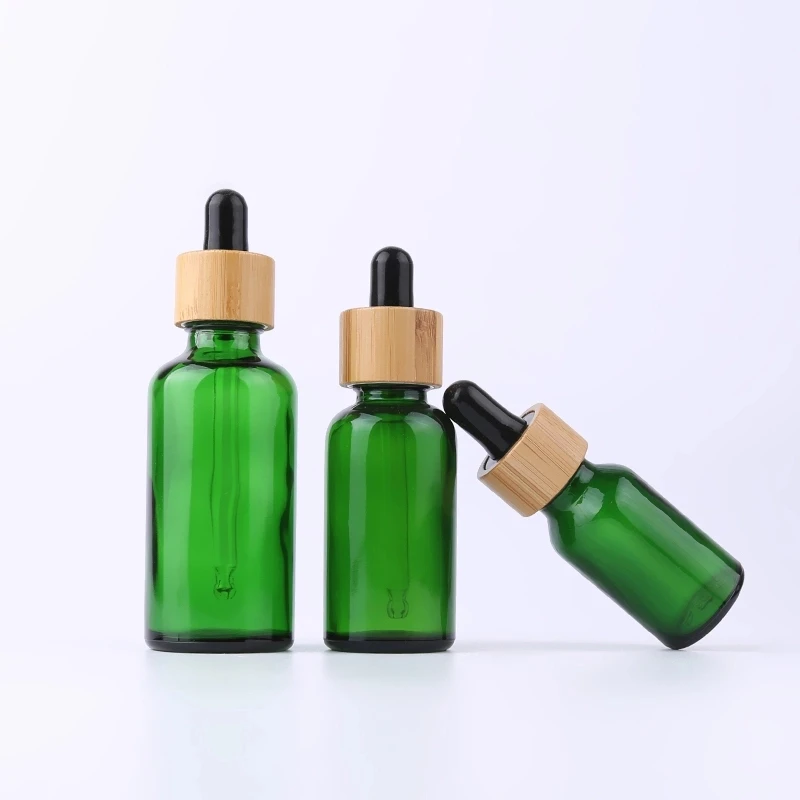 Quick sale Essential oil Green Glass dropper bottle with custom cap 10 ml 15 ml 30 ml 50 ml