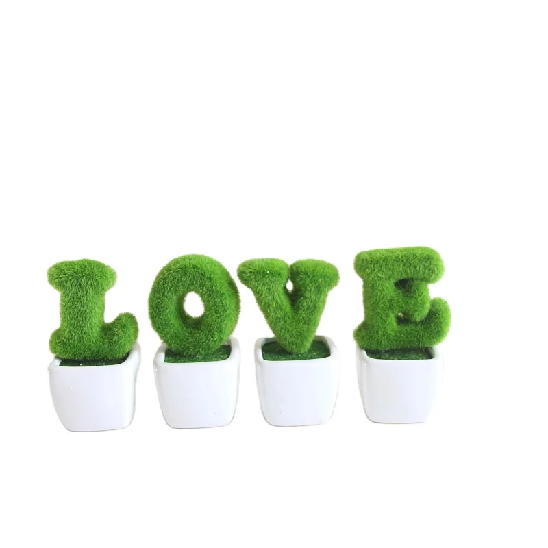 artificial plants with pots in the shape of LOVE HOME for home decor