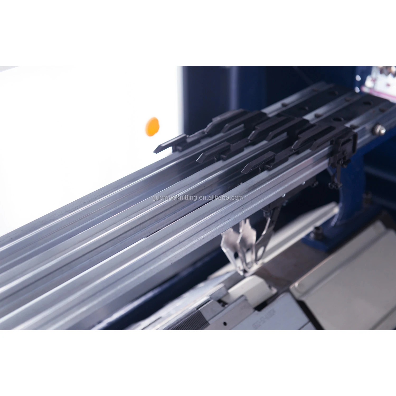 Economical single system computerized flat knitting machine