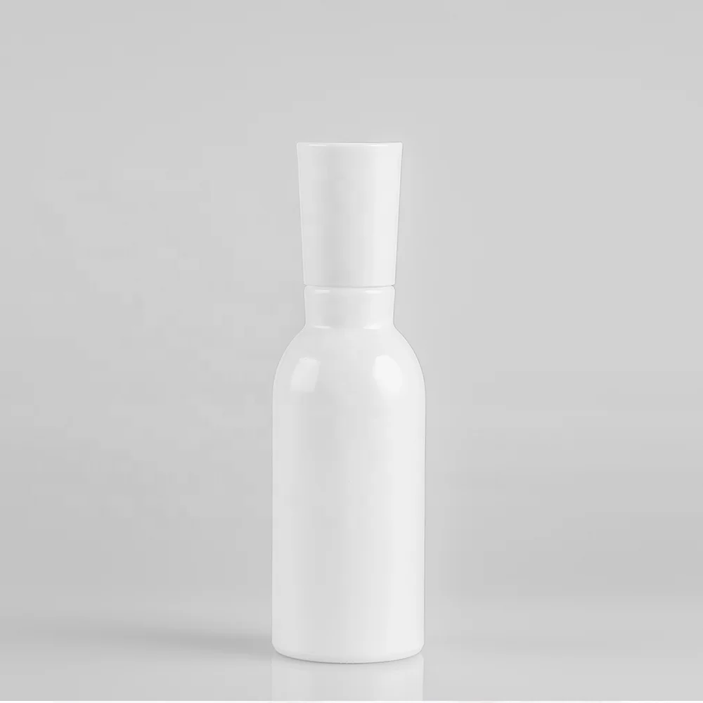 Blue glass bottle with pump and silver cap for lotion and serum