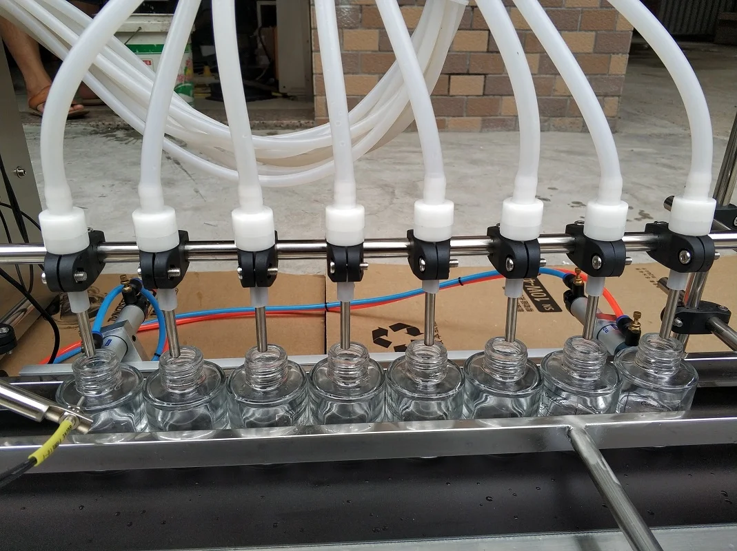 Full Automatic Desktop  With Conveyor Beverage Milk Perfume Filling Machine Water Filler CNC Liquid Oil Filling Machine