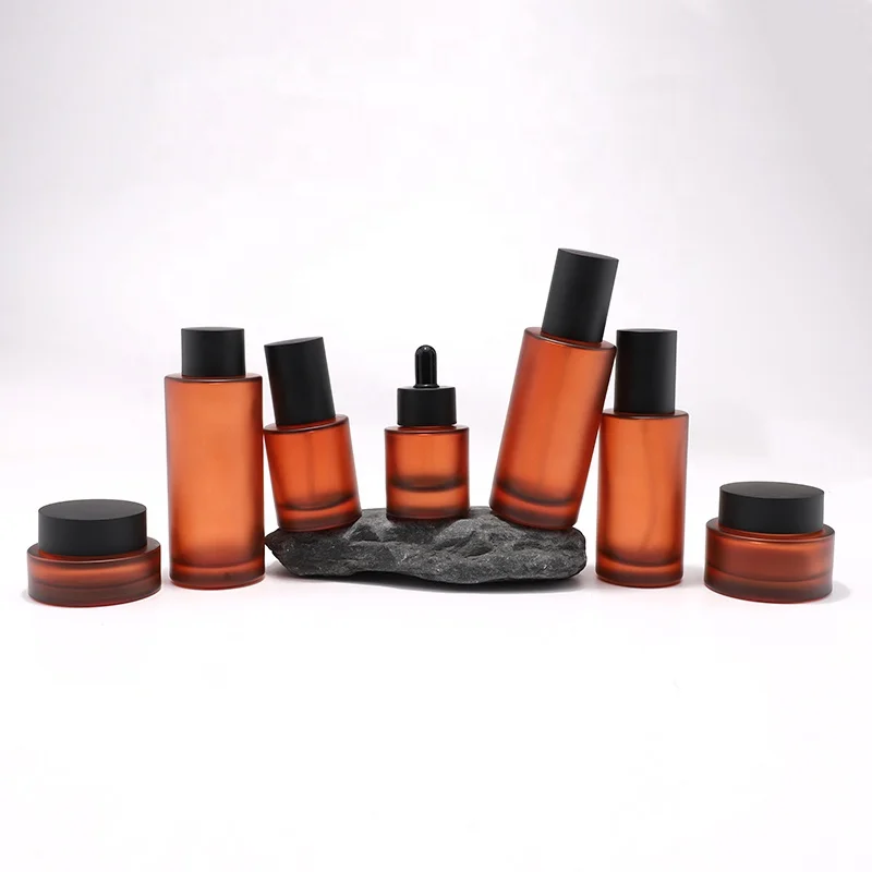 New Arrival Cosmetic Skincare Packaging Lotion Pump Bottle and Cream Jar Oil Dropper Toner Glass with Brown Frosted Amber Color