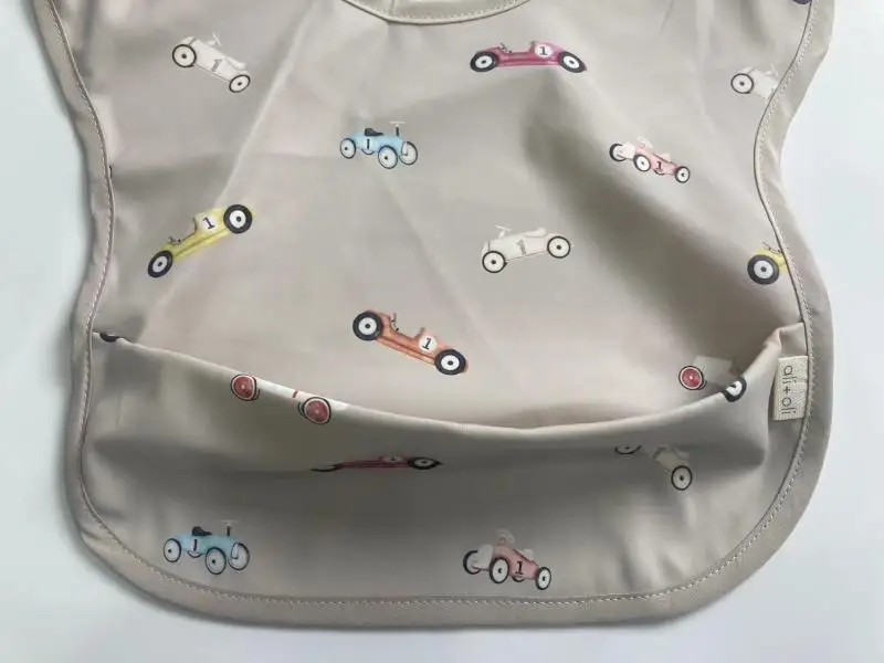Customized Baby Bibis Pu Outlet New Fabric Pu Baby Sleeveless Bibs Easy To Clean Waterproof Apron For Feeding Drawing Playing