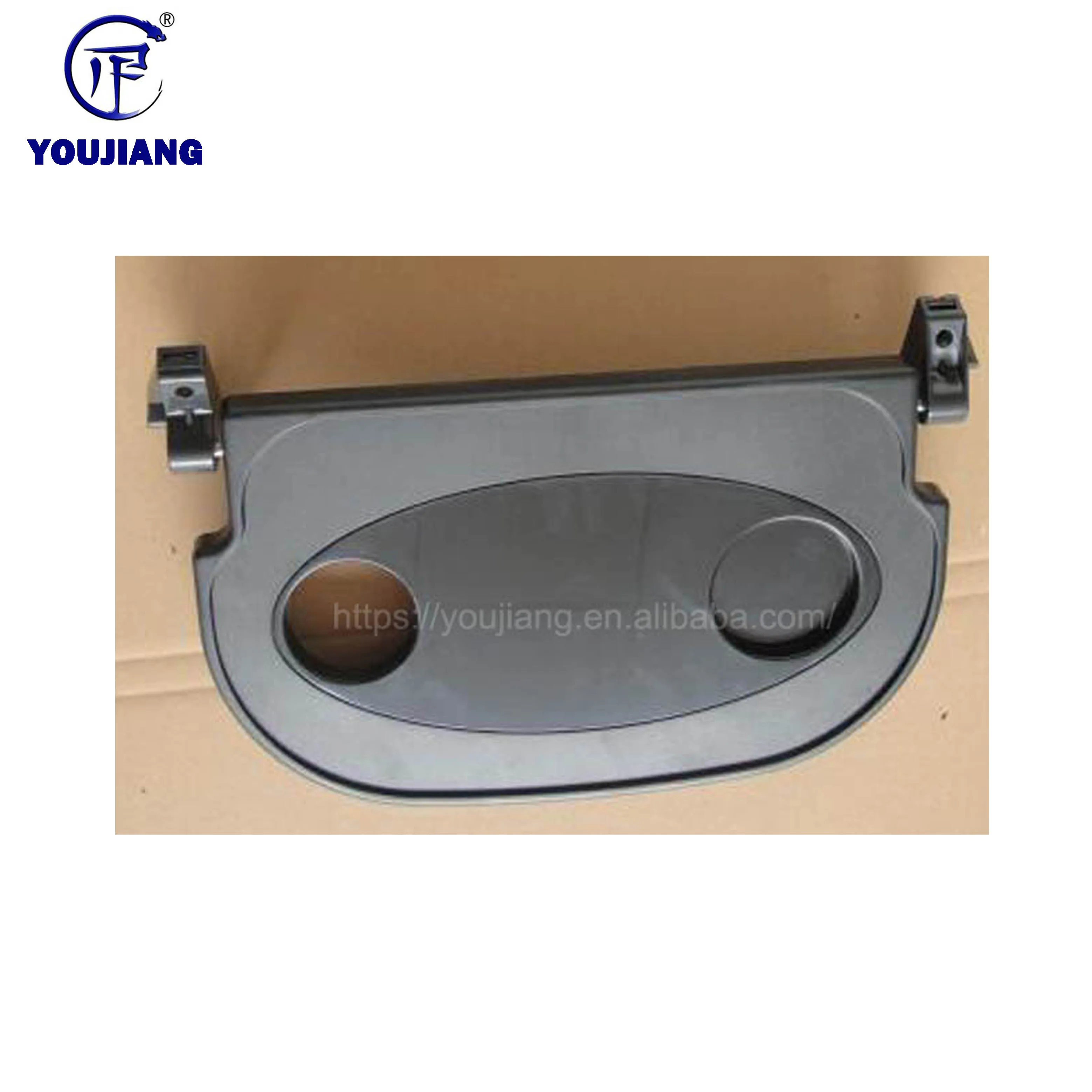 Folding plastic tray table for bus seat