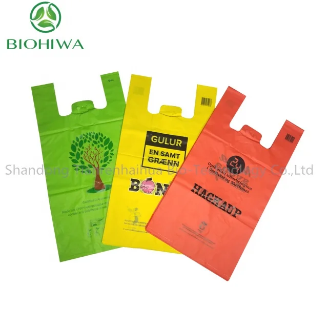 Order 1 tons Compostable T Shirt Bag Biodegradable Shopping Carry Out bag On Roll PLA PBAT Star Seal Cheap Price