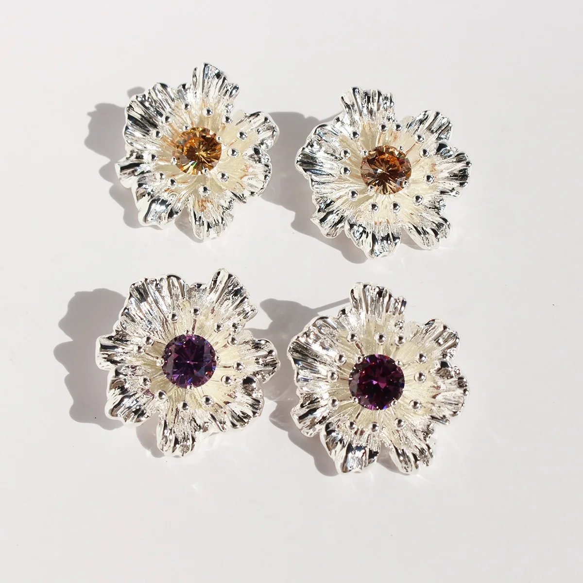 Copper plated real gold small cold silver three-dimensional flower earrings inset purple zircon exaggerated earrings 102