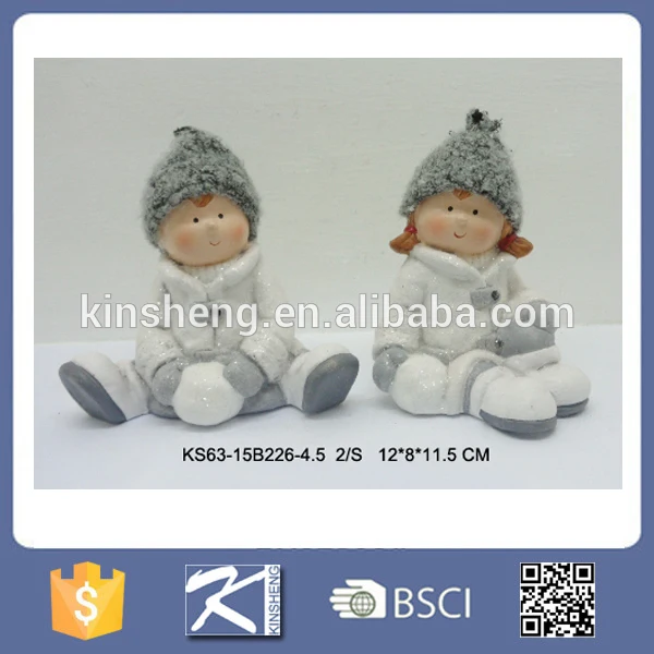 Christmas boy and girl ceramic figurines for sale