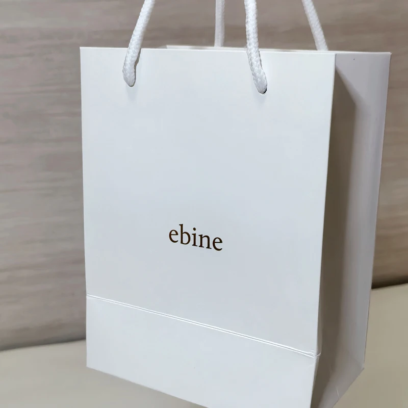 Хит продаж подарочные бумажные пакеты для одежды бизнес-операторы косметические ювелирные изделия покупок с логотипом