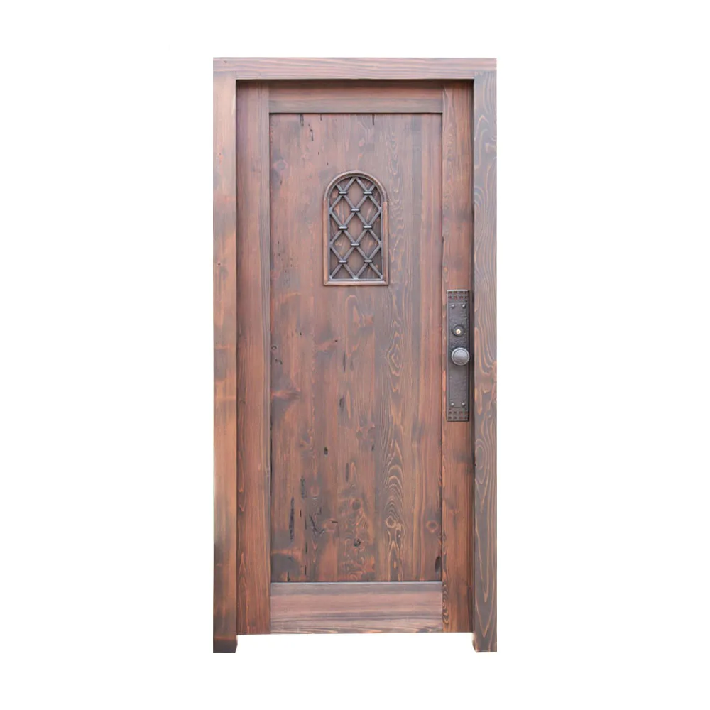 Traditional old castle wood door with wrought iron grill and clavos
