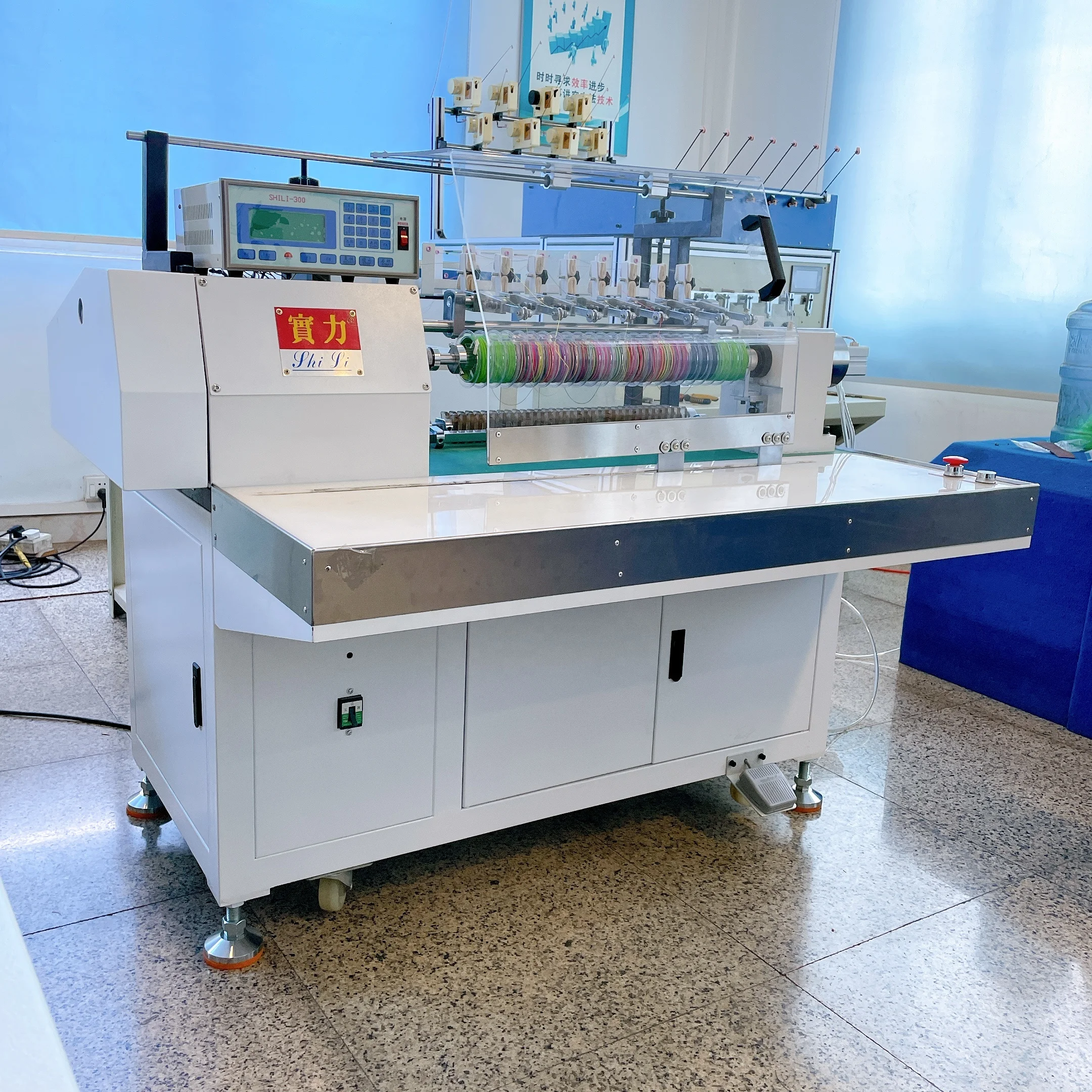 Eight spindle high production fishing line winding machine