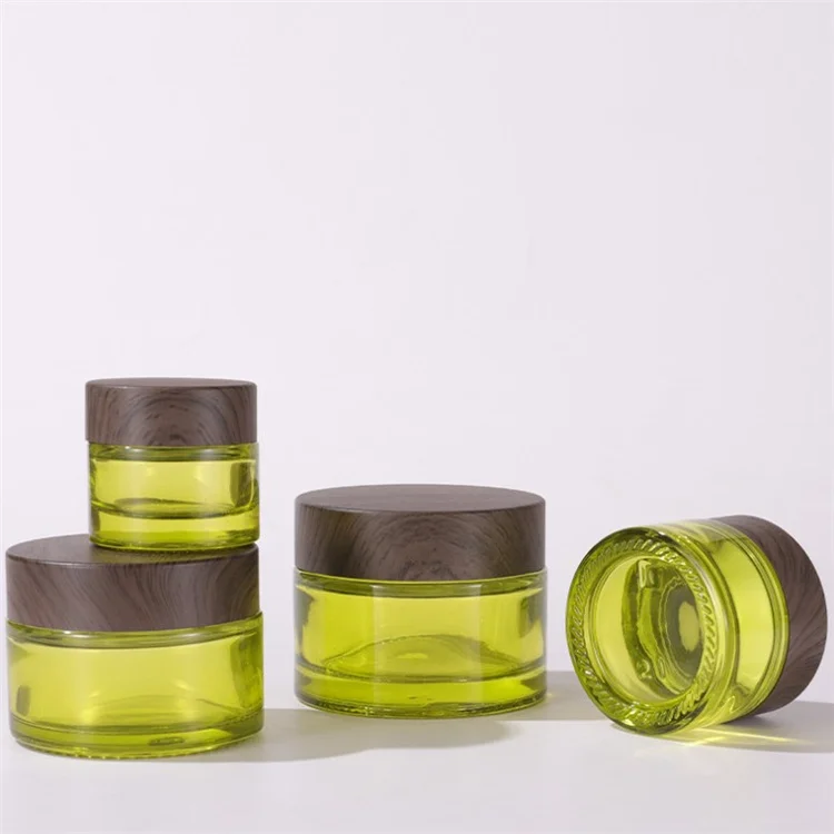 Best selling 15g 30g 50g dark wooden lid empty olive green glass jar cream bottles