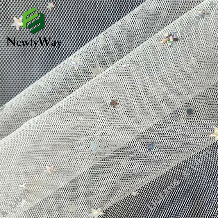 Bright sequin tulle fabric of stars and moons for the fairy skirt
