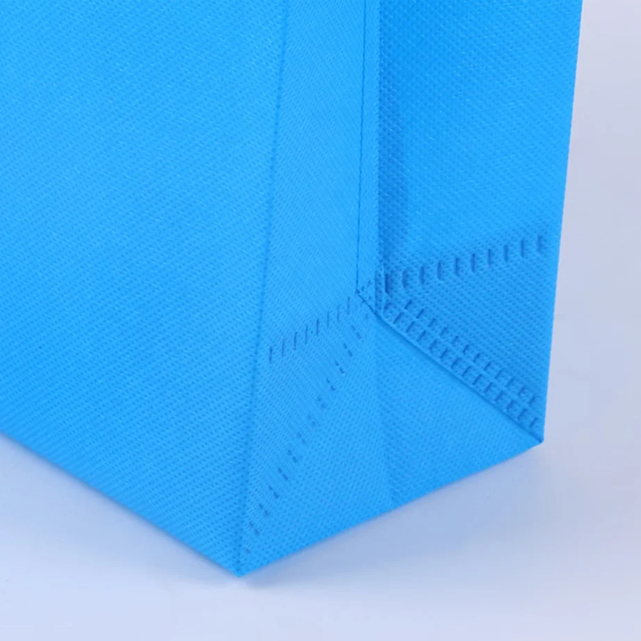 wholesale ready to ship cheap factory price reusable colorful ultrasonic non-woven handle bags for shopping