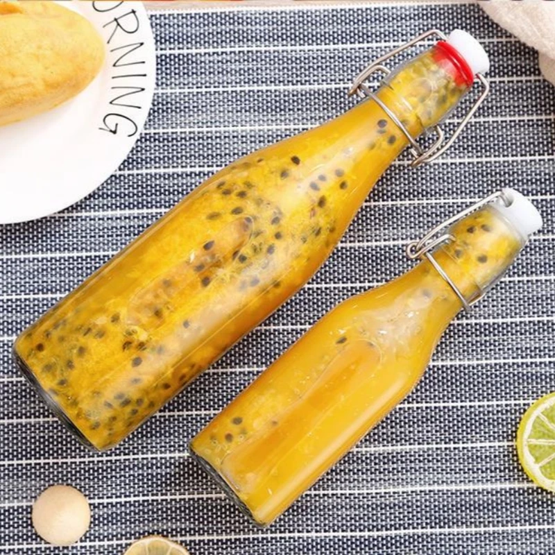 Wholesale Clasp Beverage bottle Clear Juice Drink Sealed Bottle With Lids Glass Bottle Drinking Container