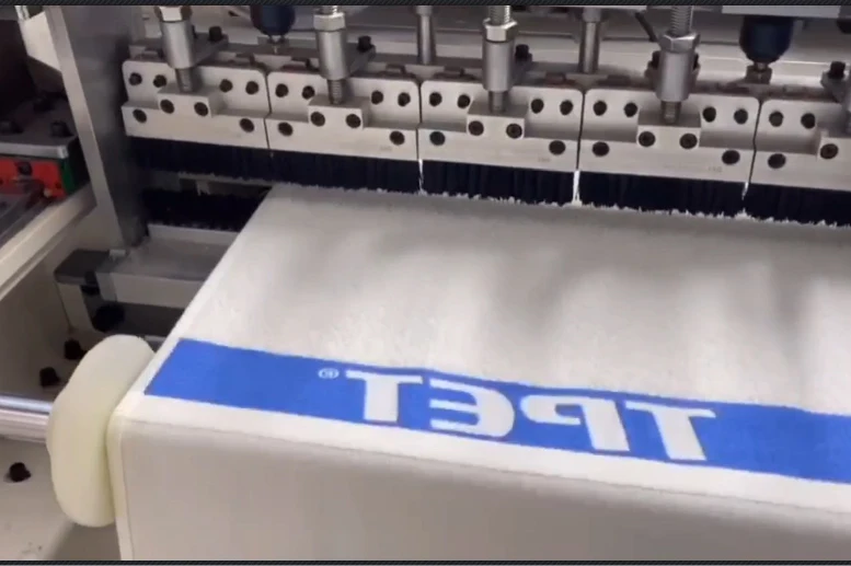 AUTOMATIC TERRY TOWEL CROSS HEMMING MACHINE