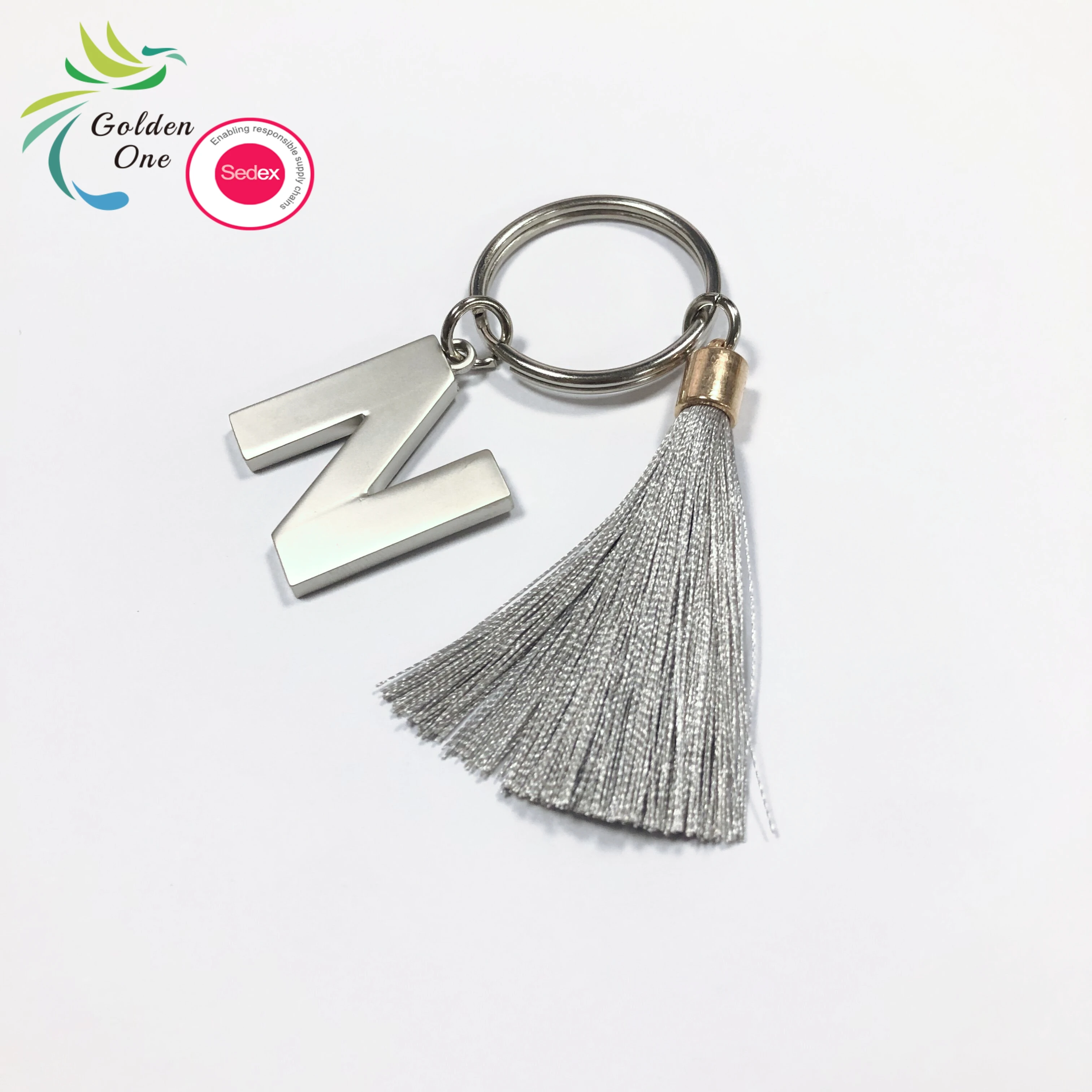 new design manufacturer colored fringe gift key chain 26 letters printing logo fashion metal keychain for bags