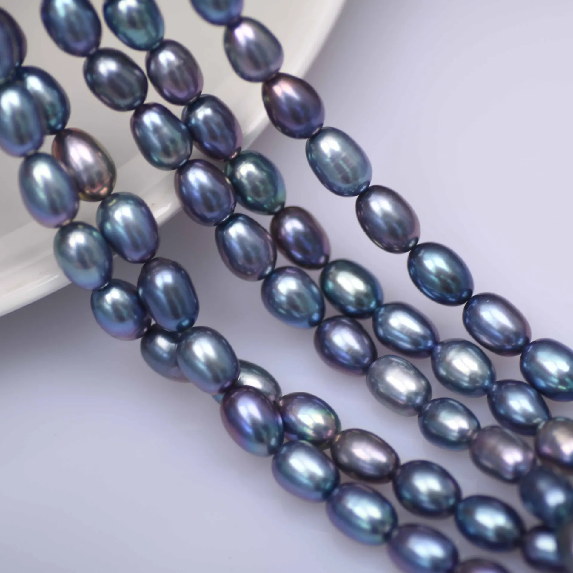 Wholesale 9-10mm Peacock Color Rice Shape  Freshwater Pearl Strands For Sale