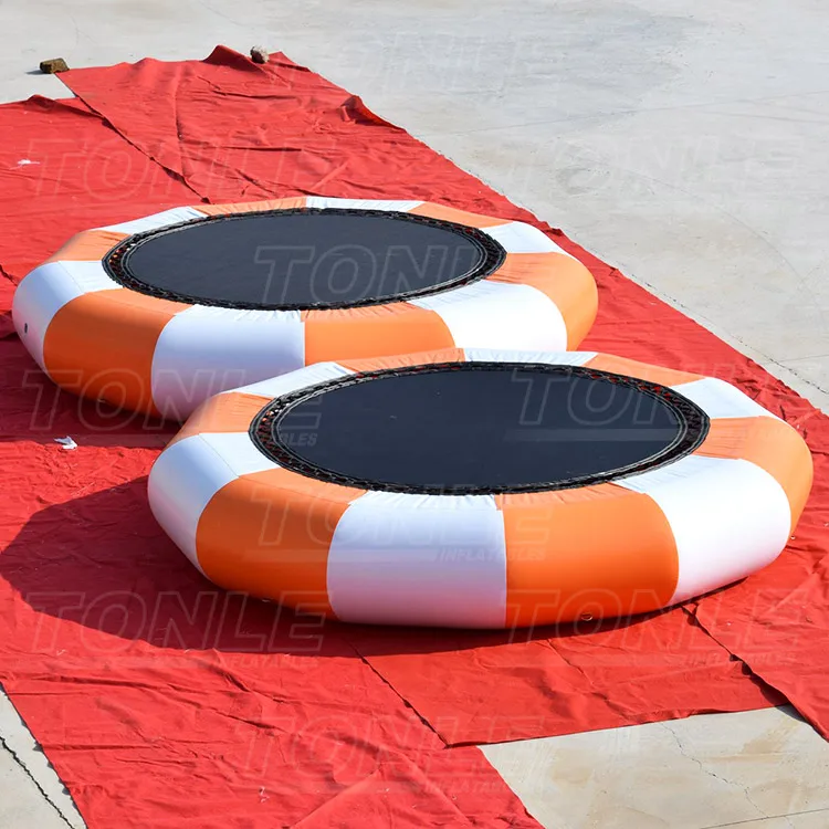 commercial cheap inflatable floating water trampoline with slide for sale