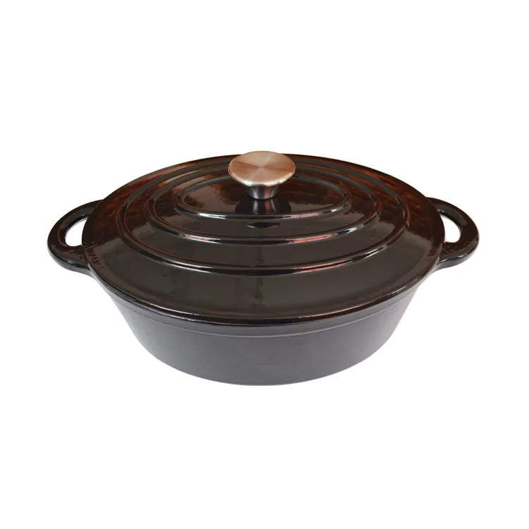 Enameled red oval cast iron dutch oven with two ears