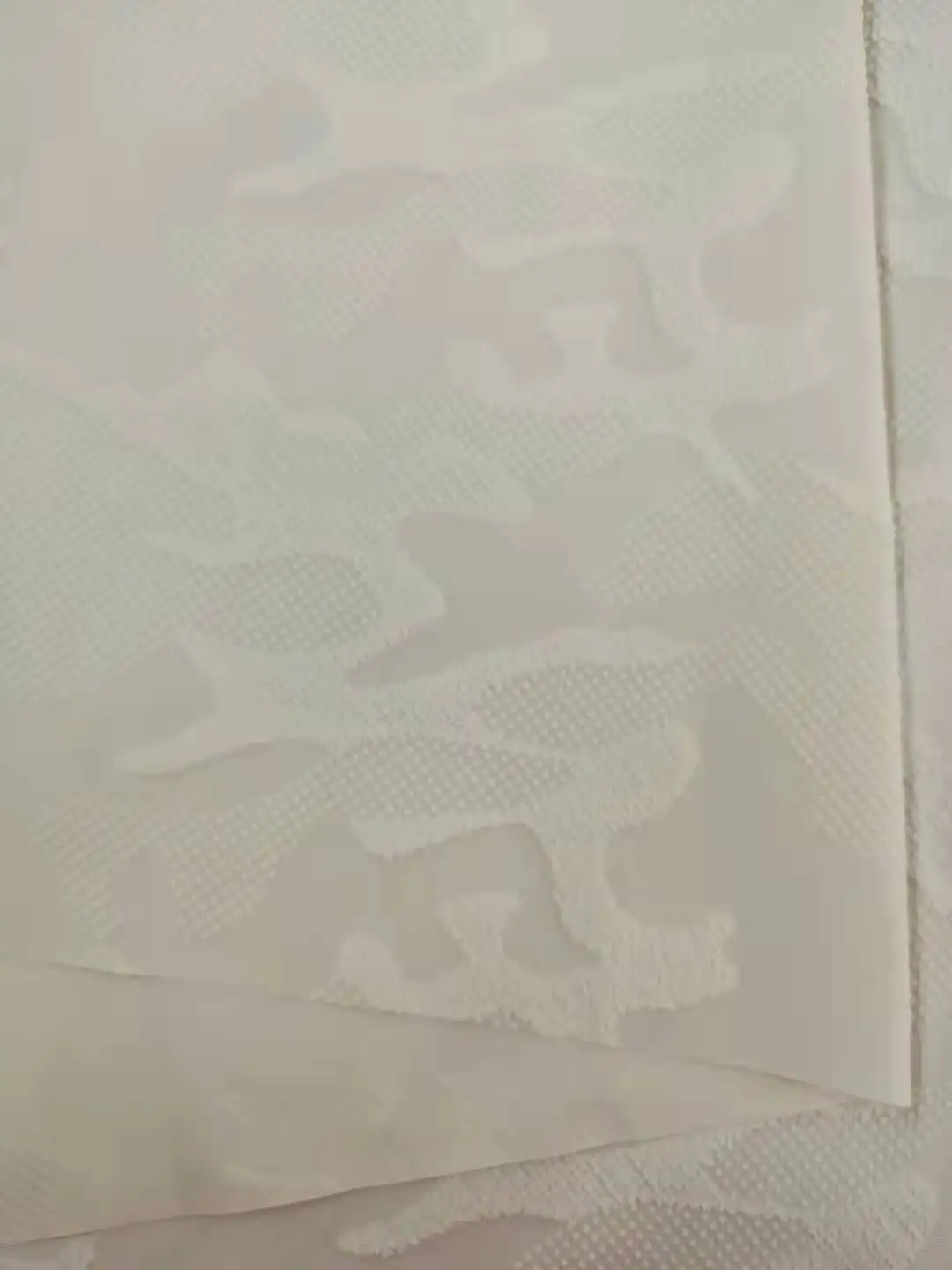 
Three dimensional relief fabric forclothing down garment 