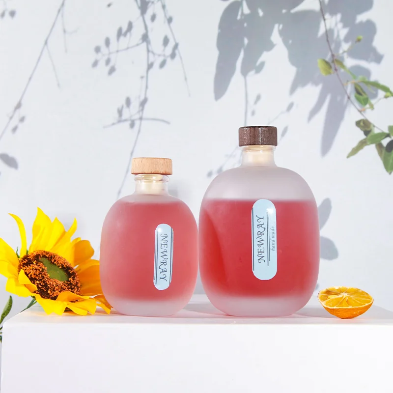 High Quality Empty 100 ml 250 ml 500 ml Round Frosted Transparent Glass Bottles for for Beverage Juice Coffee with Corks