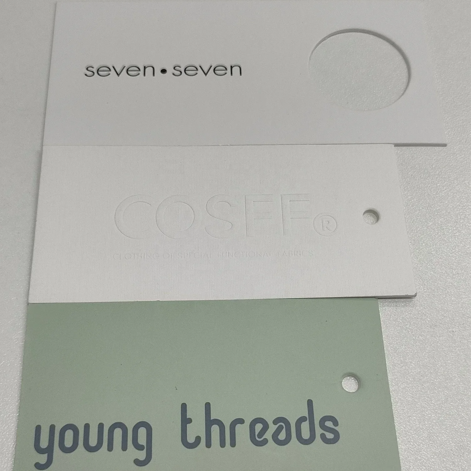 Customized luxury clothing tags clothing labels with printed name logo plastic tags with rope paper tags backpacks own logo