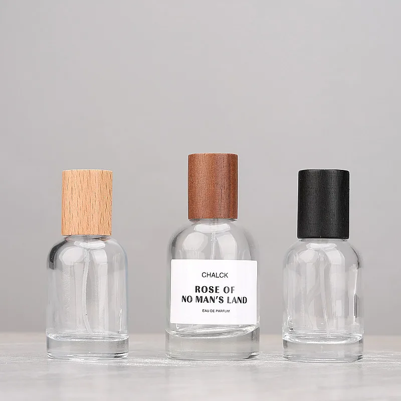 Luxury Cylinder Parfum Botol Heavy Base Glass Perfume Bottle Dubai 50ml Empty Parfum Spray Bottle With Wooden Cap