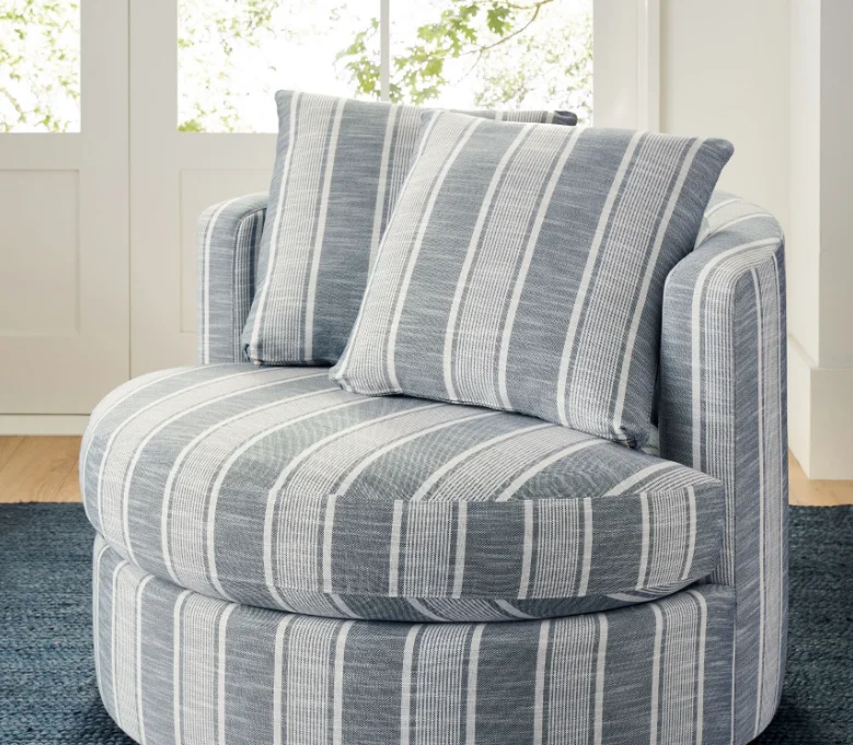 Curved silhouette and generous indoor furniture swivel upholstered comfortable sofa living room chair