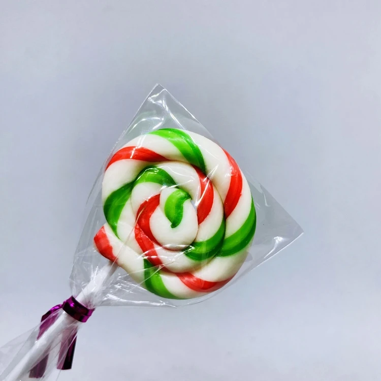 Конфеты, круглые красные и зеленые леденцы, желейные палочки, конфеты