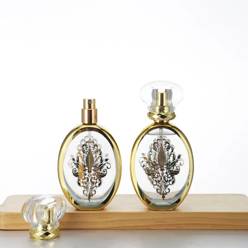 Factory Supply 50ml Arabic Pattern Flat Oval Classic Perfume Glass Packaging Fine Mist Perfume Spray Bottle with Luxury Lid