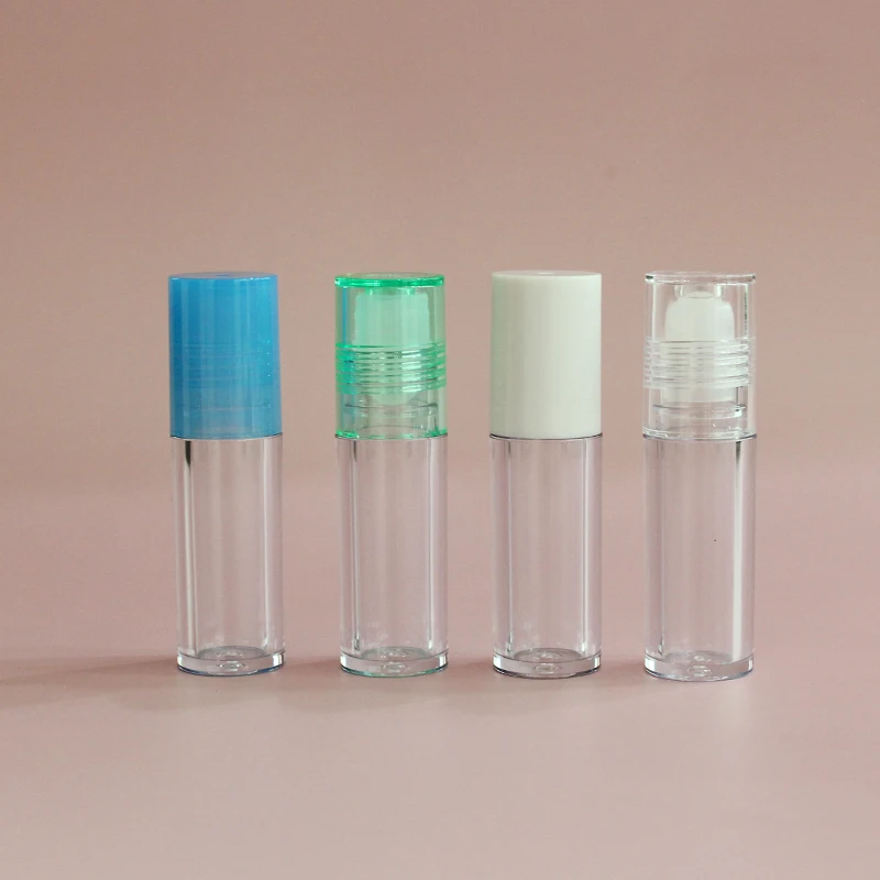 Low moq high quality round clear pink top thick wall lip oil tube  container cosmetic lip gloss packaging roll on lip gloss