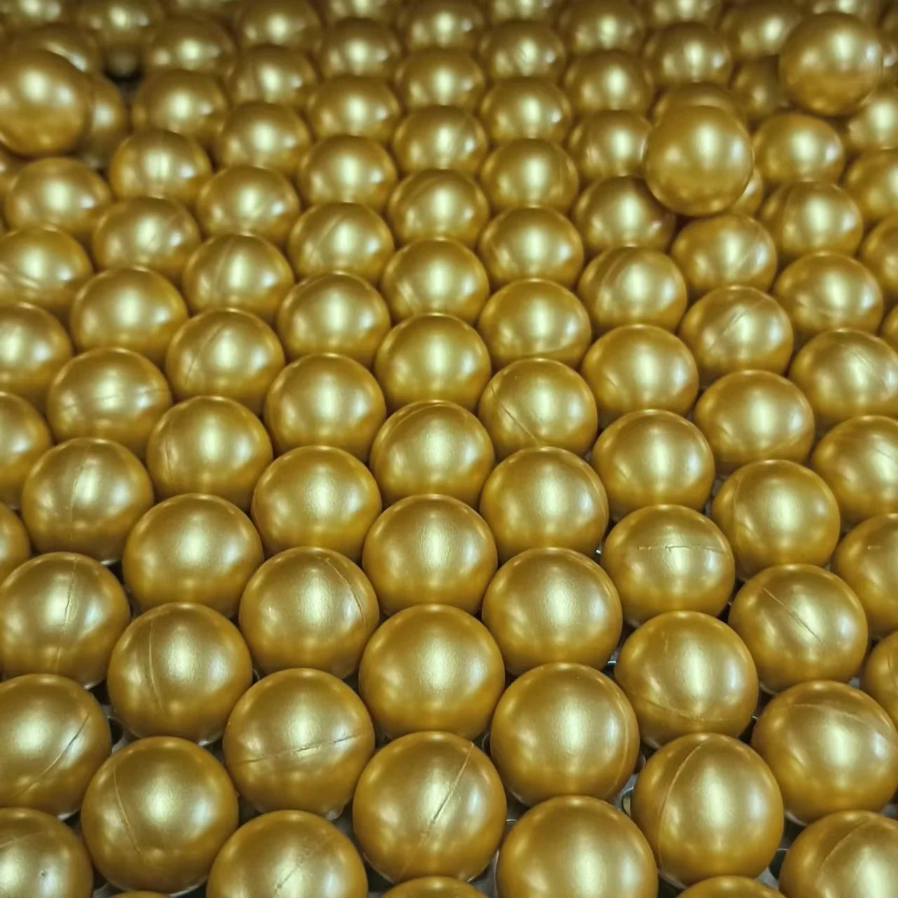 Tournament grade 0.68 PEG paintball ball with golden shell