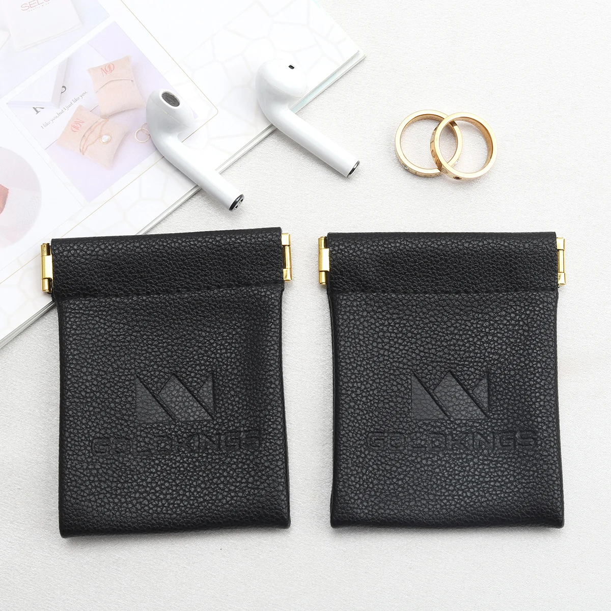 Custom Emboss Logo Reusable PU Leather Black Bag For Bluetooth Headset Packaging Shrapnel Openings Leather Dust Pouch