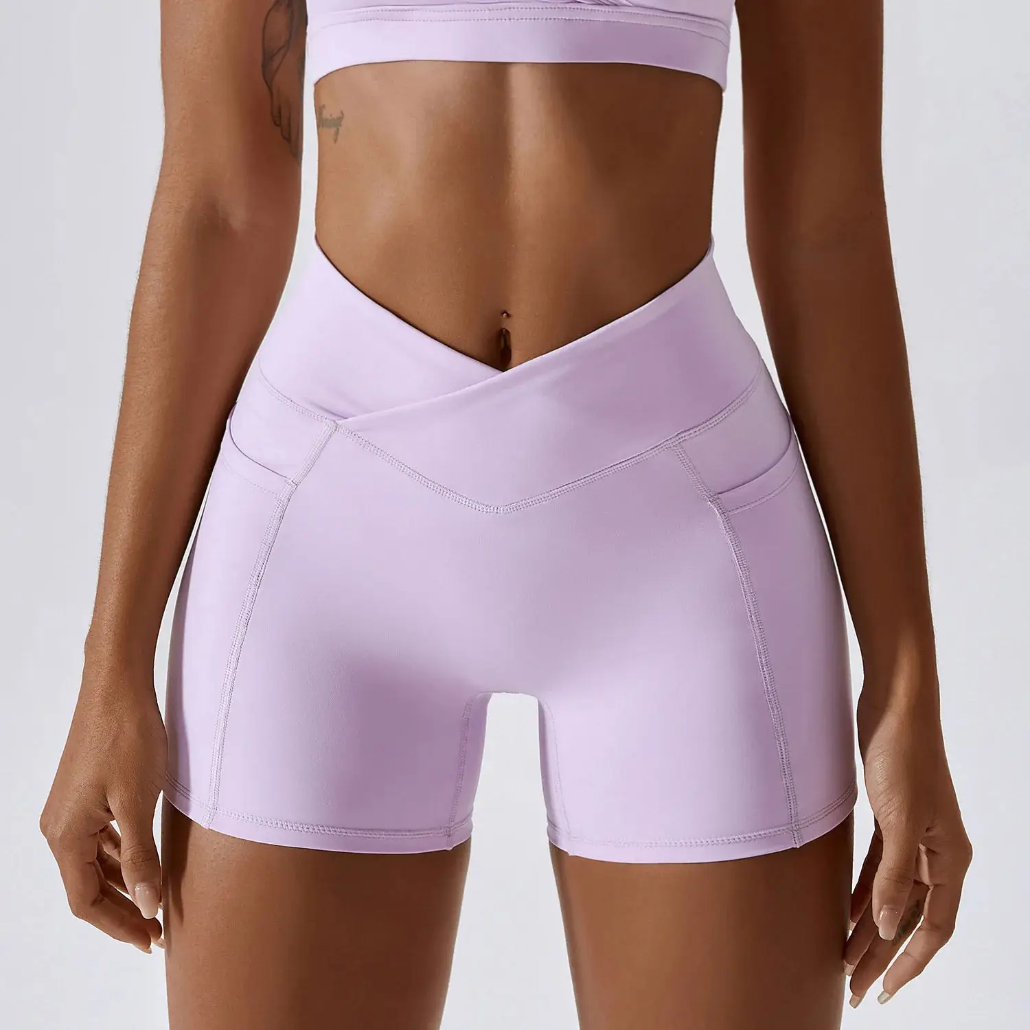 Oem Sportswear Quick Dry Nude Hip-lifting Pocket Solid Color Running Fitness Shorts Crossed Waist Tight Yoga Shorts