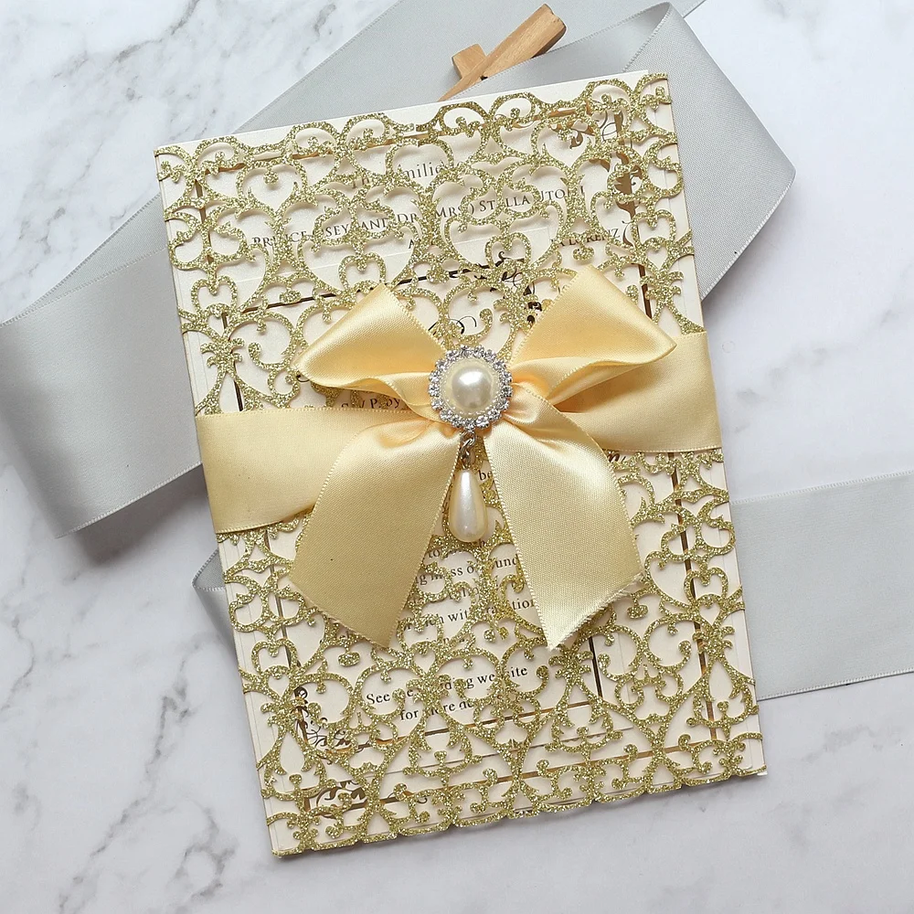
Personalized Luxury Gold Glitter Lace Laser Cut Wedding Invitations with Jewel and Satin Bow 
