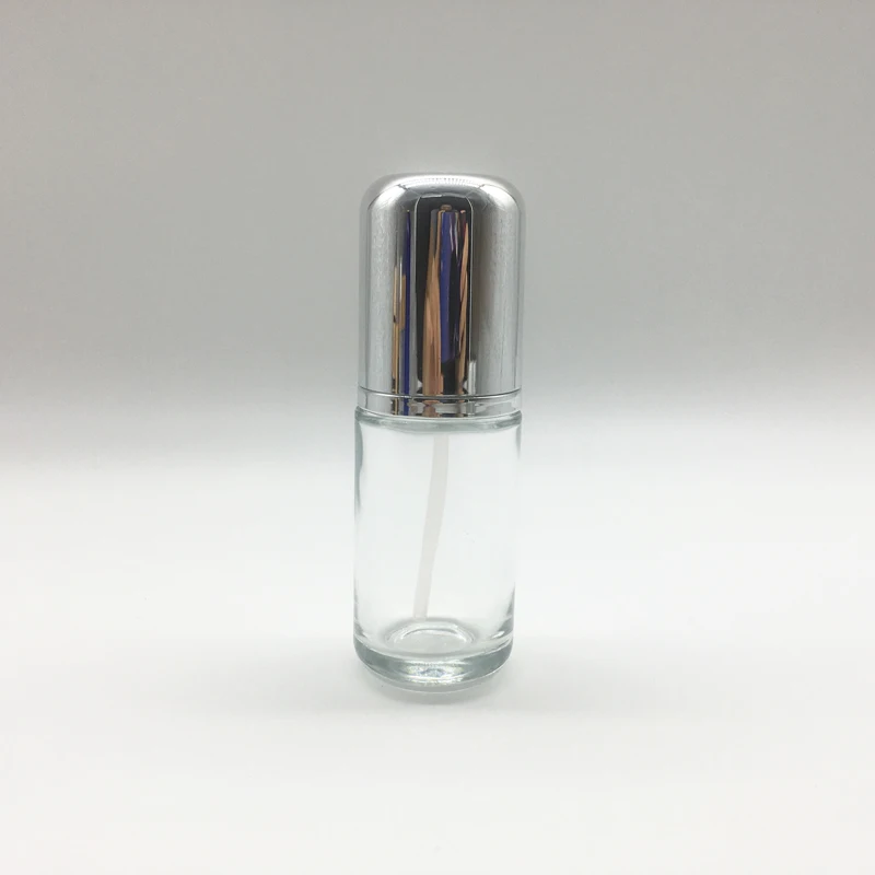 empty clear vitamin c serum glass bottles with UV silver serum pump and dome cap 40ml